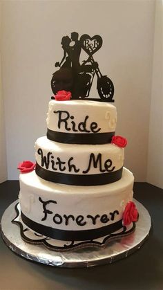 a three tiered cake with the words ride with me forever and a motorcycle on top