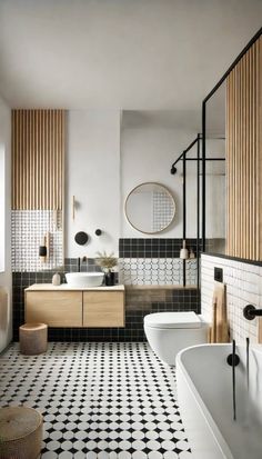 a black and white tiled bathroom with wooden accents