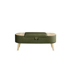 a green ottoman sitting on top of a wooden table