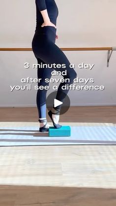 a woman standing on top of a yoga mat