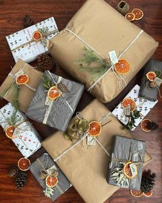 presents wrapped in brown paper and tied with twine on top of a wooden table