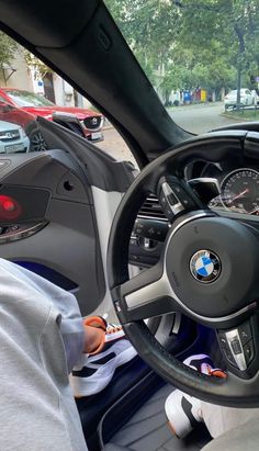 a man sitting in the driver's seat of a car