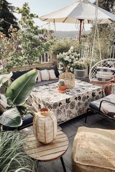 an outdoor patio with chairs, tables and umbrellas