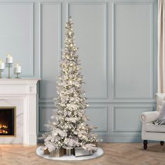 a white christmas tree in a living room