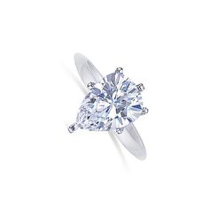 a pear shaped diamond ring on a white background