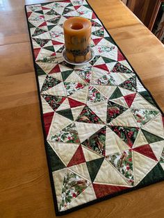 the table runner has a candle on it