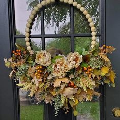 a wreath is hanging on the front door