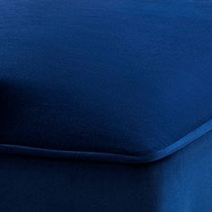 a close up view of a blue mattress with no sheets or pillows on the bed