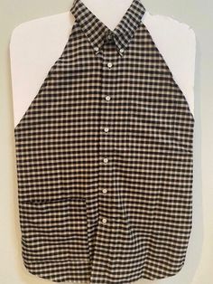 a black and white checkered shirt hanging on a wall