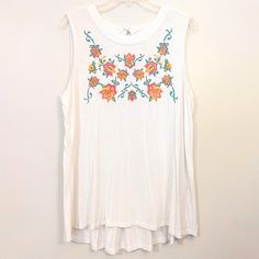 Gently Used. Got It Brand New, But Only Wore It Twice Last Summer. White Tends To Wash Me Out, Which I Didn't Know Until I Wore This Top. No Rips, Stains, Fraying Or Pilling. White Flowy Blouse, Sleeveless, With A Brightly-Colored, Floral Embroidered Front. Material Is Rayon And Spandex, And Is Stretchy. Women's Size Extra Large Machine Washable Measurements: 22 Inch Bust 29.5 Inch Length Don't Like The Price? Bundle This Item With Any Other Items Under The 5/$30 Tag To Get The Discount, Or I'm White Flowy Blouse, Floral Sleeveless Top, Blouse Sleeveless, Summer White, Flowy Blouse, Floral Sleeveless, Orange White, Got It, Women's Style