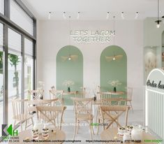 the interior of a restaurant with wooden tables and chairs in front of large windows that say let's laom together