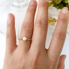 ✨ Mother Of Pearl Ring with 14K Gold Filled or Sterling Silver wire 🐚 Mother of pearl, also known as shell beads, is a stone of protection. It brings the gentle healing power of the sea. It is a stress-relieving stone; relaxing, soothing and calming to the emotions 💙 Tiny, dainty and cute Mother Of Pearl ring. You can wear it alone or stack them together. Make a cute pinky ring. Sizing: *Gemstone Diameter: 4 mm *Ring Band: 0.8 mm * Handmade in your ring size with 14K gold-filled wire or Sterli Dainty Pearl Ring With Pearl Charm For Gifts, Dainty Pearl Ring With Pearl Charm As Gift, Adjustable Pearl Birthstone Ring For Wedding, Wedding Pearl Birthstone Ring, Pearl Ring With Pearl Charm As Gift, Pearl Rings With Pearl Charm As Gift, Gift Pearl Ring With Pearl Charm, Adjustable Rings With Pearl Charm As Gift, Adjustable Rings With Pearl Charm For Gifts