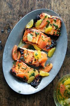 salmon with lemons and herbs on a plate