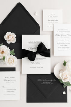 an elegant black and white wedding suite with flowers on the front, side, and back