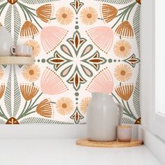 a white shelf with two vases sitting on top of it next to a wall