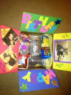 the contents of a birthday gift laid out on top of a table with pictures and candy