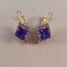 These Beautiful Mystical Pink Purple Diamond Square Princess Cut Czech Crystal Earrings Are Gold Plated. Brand New And Never Been Worn. Lead And Nickel Free. These Fine Quality Earrings Are Perfect For Everyday Wear, Special Occasions, Or A Special Gift. Get An $18 Gift Of Your Choice In My Listings With Purchase Of Two Or More Items. Please Send Offers And Questions. Large Crystal: 8mm Fastening: Clip Back Dangle (Pierced) Purple Crystal Drop Earrings For Evening, Purple Drop Crystal Earrings For Evening, Purple Dangle Earrings For Evening, Elegant Purple Crystal Earrings For Evening, Nickel-free Purple Earrings For Party, Czech Jewelry, Purple Diamond, Large Crystal, Pink Jewelry