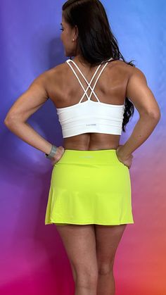 Be bold and adventurous with our Adventure Skirt in Neon Green! Whether you're hitting the beach, the city, or just taking a stroll, this skirt will add a pop of color and functionality. Built-in shorts and a pocket make it perfect for any occasion, while its antibacterial and quick dry features keep you feeling fresh and comfortable. It's time to add some bright vibes to your wardrobe! Womens Cycling Clothes, Tank Top Bras, Resort Collection, Cycling Outfit, Be Bold, Windbreaker Jacket, Neon Green, Cropped Tank Top, Skirt Pants