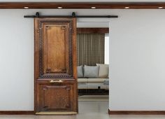 a large wooden grandfather clock sitting in the middle of a living room