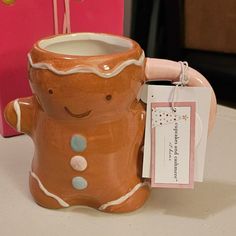 a ceramic ginger mug with a tag on it