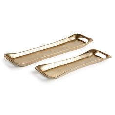 two gold serving trays with handles on each side, one is empty and the other has