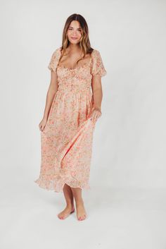 This stunning dress brings just the right amount of whimsy and charm to your wardrobe! The Lunaria Midi Dress offers a feminine, floral print that'll you'll love wearing to summer soirees, with a pleated, bustier-style bodice and underwire bra. You'll treasure this gem season after season. Available in two colorways. FIT: Runs true to size - very fitted in the bodice. Not recommended for D-cup and above. MATERIAL: 100% Polyester. Dry clean only. GARMENT DETAILS: Lightweight floral midi dress wit Floral Print Midi Dress With Fitted Bodice, Summer Midi Dress With Sweetheart Neckline For Garden Party, Summer Floral Dress With Sweetheart Neckline For Brunch, Floral Print Summer Midi Dress With Sweetheart Neckline, Feminine Fitted Bodice Maxi Dress For Summer, Summer Midi Dress With Sweetheart Neckline And Floral Print, Floral Print Dresses With Sweetheart Neckline And Fitted Bodice, Summer Floral Print Midi Dress With Fitted Bodice, Spring Flowy Floral Dress With Ruched Detail