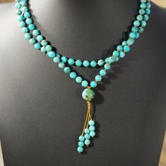 Authentic Turquoise Mala Necklace: 108 Beads for Peace & Tranquility Embrace inner peace and wisdom with this handcrafted turquoise mala necklace. Features: 108 genuine turquoise beads: Each bead hand-knotted for mindful meditation. Calming turquoise color: Evokes feelings of balance, peace, and inner strength. Durable nylon cord: Designed for long-lasting wear and comfort. Simple yet elegant beaded tassel: Adds a touch of tradition. Perfect for meditation, prayer, or everyday wear: Wear your in Adjustable Turquoise Jewelry With 108 Beads, Spiritual Turquoise Beaded Necklaces With Gemstone Beads, Spiritual Turquoise Gemstone Beaded Necklaces, Adjustable Beaded Turquoise Necklace For Meditation, Handmade Turquoise Beaded Necklaces For Meditation, Turquoise Beaded Necklace For Meditation With 8mm Beads, Spiritual Turquoise Beaded Necklace With 108 Beads, Turquoise Beaded Necklaces For Meditation, Turquoise Beaded Necklaces With 8mm Beads For Meditation