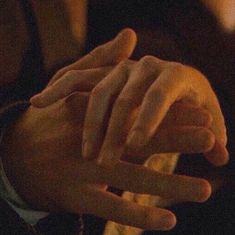 two hands touching each other with their fingers