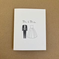 a wedding card with the words mr and mrs written on it, next to a drawing of a bride's dress