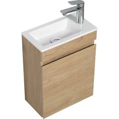 a bathroom sink sitting next to a wooden cabinet with a faucet on it