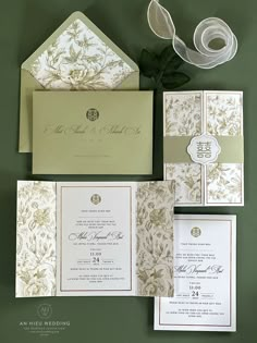 the wedding stationery is laid out on top of each other