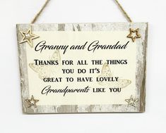 a sign hanging on the side of a wall that says, granny and grandad thanks for all the things you do's great to have lovely grandparents like you