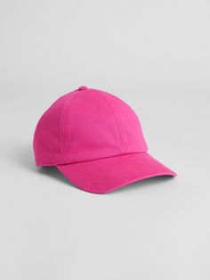 a bright pink baseball cap on a gray background