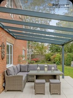 an outdoor living area with patio furniture