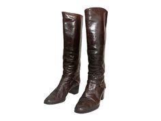 "Vintage 70s brown leather knee-high riding boots with metal details on the heels. These boots feature a chunky heel and a front strap. They are pull-on style, making them ideal for narrower feet.  Good vintage condition - some wear, marks and staining to be expected due to age. They could be smoothed down and re-polished by a cobbler if wanted. Size: Labelled as a size EU 40.5 so would fit a UK 7.5 US 10 Measurements: - Heel height 2.25\" - Insole 10.25\" - Calf 7.25\" (side to side, double for circumference) - Boot height 18.25\" FAQs: 💌 I usually send orders every Monday but might be delayed if there are any bank holidays or a higher amount of orders that week.  💌 All orders are sent in recyclable paper bags or cardboard boxes. Labels are printed on recycled paper and packages are sea Vintage Knee-high Boots For Formal Occasions, Brown Riding Boots, Long Wool Coat, Cobbler, Lace Up Boots, Chunky Heels, Vintage 70s, Boot Shoes Women, Knee High