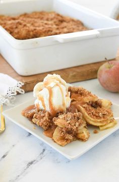 a white plate topped with waffles covered in ice cream