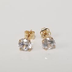 Thanks for shopping our vintage estate store. We tend to sell well below wholesale and truly hope you enjoy all of our items. Many of the items are one of a kind, so please enjoy scrolling through the pictures and hopefully something will catch your eye. Brown spots are from camera. Nice estate 14k yellow gold 1ct cz diamond stud earrings. Size: 5mm Weight: .66 grams Cz round: .50ct per stud Marked 14k and these are nice cz diamond studs. Backs are included. Classic Gold Hallmarked Diamond Earrings, Classic Gold Diamond Earrings Hallmarked, Gold Hallmarked Diamond Earrings For Anniversary, Anniversary Gold Hallmarked Diamond Earrings, Classic 14k Gold Earrings For Anniversary, Classic 14k Gold Diamond Earrings, Hallmarked, Classic Gold Diamond Earrings As Gift, Classic Gold Diamond Earrings For Gift, Classic Gold Earrings With Brilliant Cut