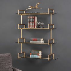 a bookshelf with three shelves and two chairs in front of the wall next to it