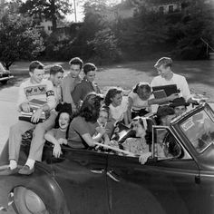 a group of people sitting in the back of a car