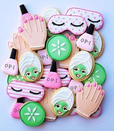 decorated cookies are arranged in the shape of hand, eye and face masks on top of each other