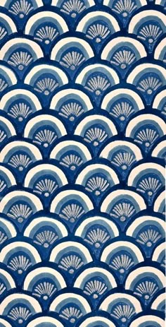 blue and white art deco wallpaper with fan design on it's back side