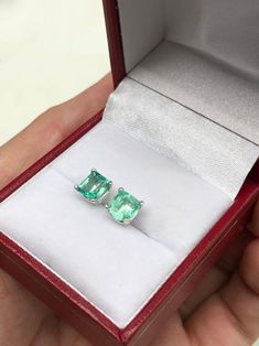 Featured here is a beautiful set of Asscher cut Colombian emerald studs in fine .925 sterling silver. Displayed are crystal clean light-green emeralds with very good transparency, accented by a simple four-prong silver mount, allowing for the emerald to be shown in full view. The earth mined, green Colombian emeralds have a desirable lush green color with excellent qualities. These earrings are ideal for everyday use and are the perfect accessory to any outfit. Approximate Total Carat Weight: 2. Emerald Studs, Emerald Stud Earrings, How To Clean Crystals, Earrings Emerald, Emerald Earrings Studs, Colombian Emeralds, May Birthstone, Asscher Cut, Emerald Engagement