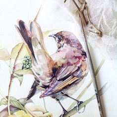 a watercolor painting of a bird sitting on a branch