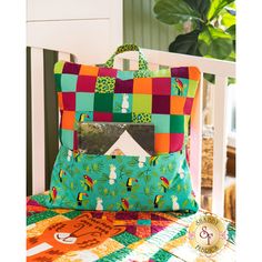 a colorful patchwork bag sitting on top of a table