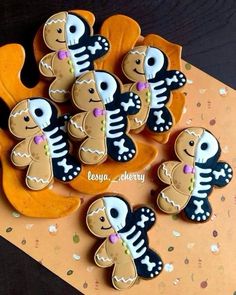 decorated cookies are arranged in the shape of skeletons