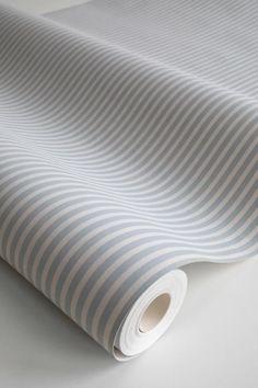 a white and grey striped wallpaper with stripes