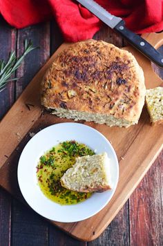 the bread has been sliced and is ready to be served on the cutting board with olive oil