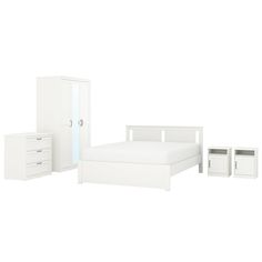 a white bedroom set including a bed, dresser and night stand