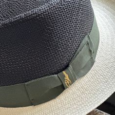 Experience luxury with the Panama Fox Two Tone hat. Made of authentic handwoven panama, this limited edition hat features a black Panama crown and white Panama brim, accented with a 1.5 inch green grosgrain ribbon. The gold Bellissimo logo certifies the quality of this high-end hat. Limited quantity available. Black Adjustable Panama Hat With Flat Crown, Black Toquilla Straw Hat With Curved Brim, Black Toquilla Straw Hat For Kentucky Derby, Black Brimmed Panama Hat For Formal Occasions, Black Curved Brim Panama Hat For Formal Occasions, Classic Black Straw Hat With Curved Brim, Formal Black Brimmed Panama Hat, Formal Black Panama Hat With Curved Brim, Black Panama Hat With Curved Brim For Kentucky Derby