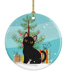 a christmas ornament with a black cat sitting in front of a tree and presents